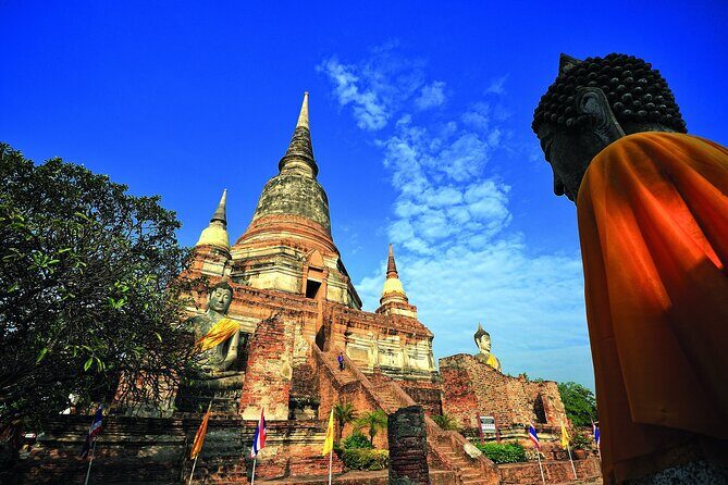 Discover Ayutthaya at Sunset: Historic Temples & River Cruise - The Guide Experience: Fast Context, Storytelling, and Keeping the Group Together