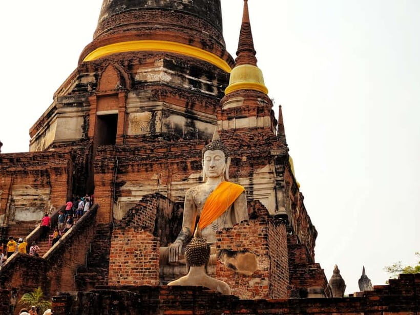 From Bangkok: Ayutthaya & Ayothaya Floating Market Day Trip - Wat Mahathat: The Buddha Head in the Tree Moment