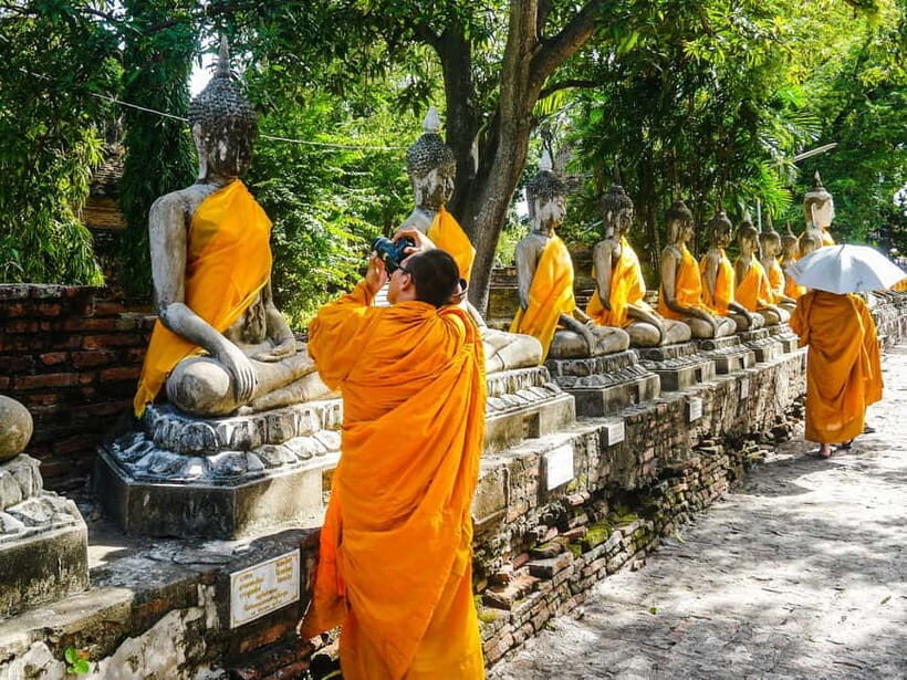 From Bangkok: Ayutthaya Heritage Tour with Sunset Boat Ride - Wat Maha That: the Buddha head in tree roots is the reason people come
